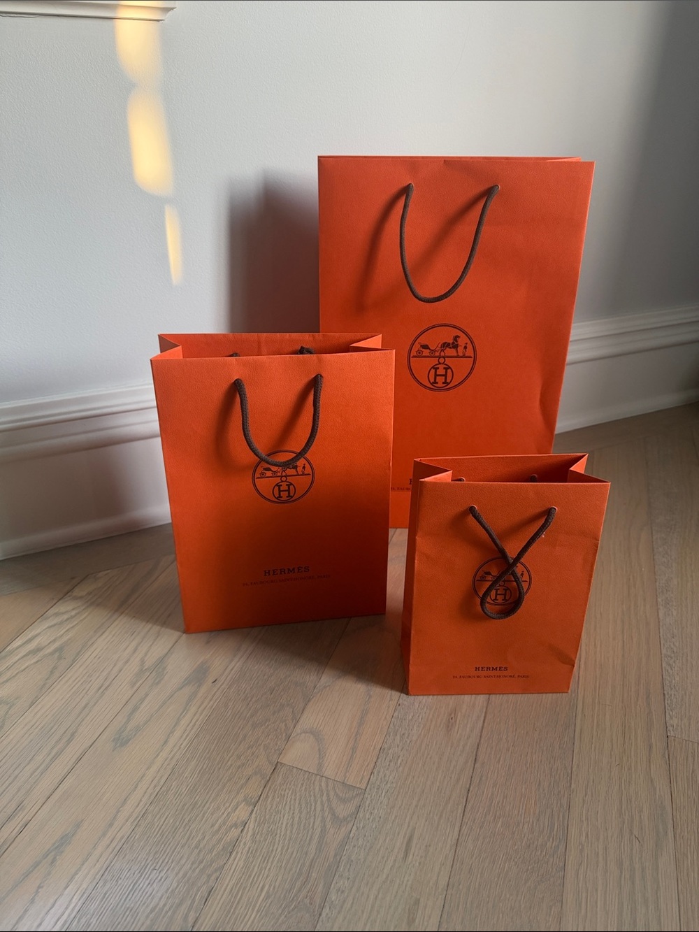 HERMES  Vibrant Orange Bags with Black Accents and ribbon
